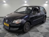 a picture of a small black car parked in a garage