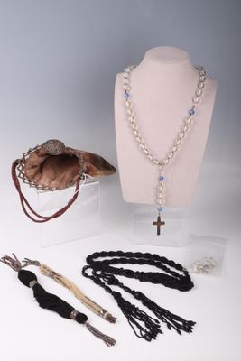 a necklace, bracelets, and other jewelry on display