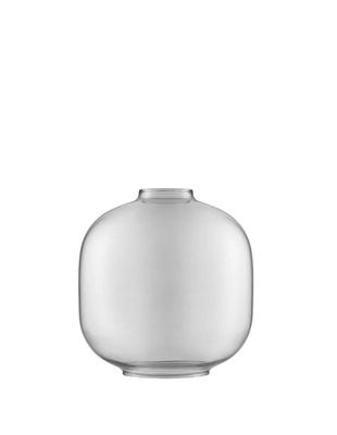 an image of a glass vase with a white base on a white background