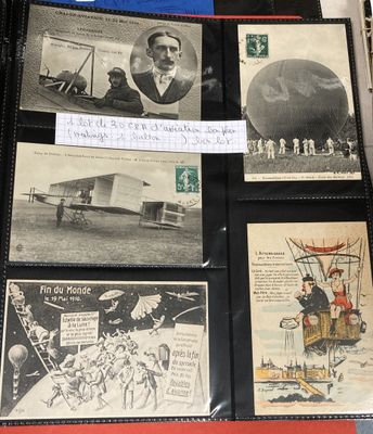 an old photo of a collection of old postcards on a table