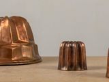 three chocolate molds sitting on a table next to each other