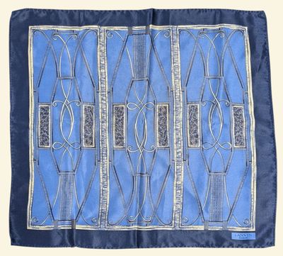 a blue and white silk scarf with a design on it