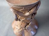 a vase that has a design on it