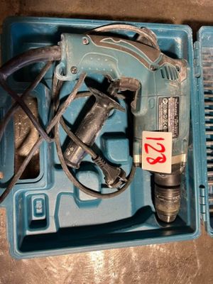 a blue box with tools in it on a table