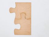 a wooden puzzle piece with a missing piece in the middle