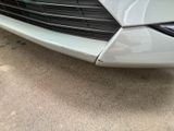 a close up of the front of a white car