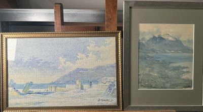 two framed paintings on a shelf next to a chair