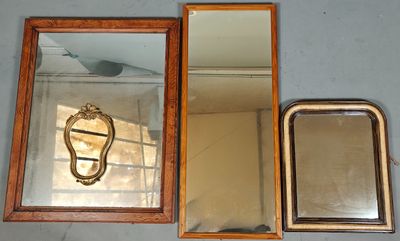 three mirrors on the wall and a mirror with a bird on it