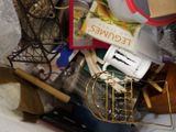 a pile of kitchen utensils and other items on a table