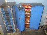 two blue cabinets that are next to each other in a room
