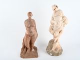 two statues of a woman and a man on a white background