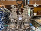 a glass table with a lot of glass items on it