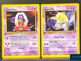 two pokemon cards are shown on a table with a black background
