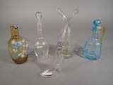 three glass vases sitting next to each other on a table