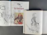 a lot of books that are open on a table