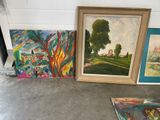 three paintings on the floor next to each other