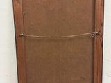 an old wooden picture frame with a rope hanging from it ' s side