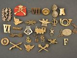 many different types of military badges displayed on a table