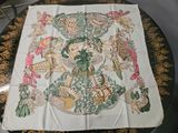 a table with a table cloth on it that has a picture of animals on it