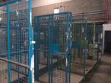an image of a caged in area of a warehouse