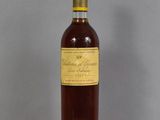 an image of a bottle of wine sitting on top of a table
