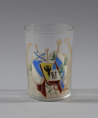 an image of a shot glass with a coat of arms on it
