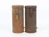 two trash cans sitting next to each other on a white surface