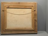an old picture frame with a rope hanging from it ' s side