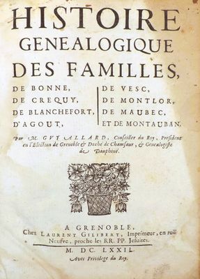 an old book with a picture of a vase of flowers on top of it