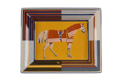 a picture of a painting of a horse on a plate