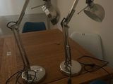 two lamps that are on top of a wooden table