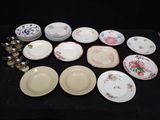 a lot of plates that are sitting on a table