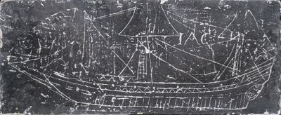a black and white photo of a ship on a stone slab