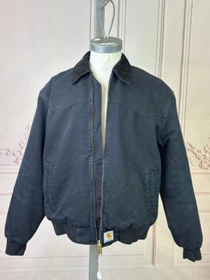 jacket on a mannequin stand in front of a white wall