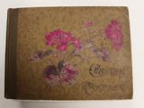 un vieux livre avec une illustration de fleurs sur la couverture