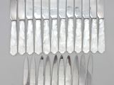 a lot of knives that are sitting on a table