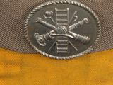 a close up of a hat with a badge on it