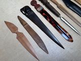 many different types of knives that are on the table