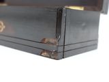 a black box with a gold design on it