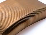 a close up of a metal object on a white surface