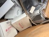 a pile of boxes that are sitting on a couch