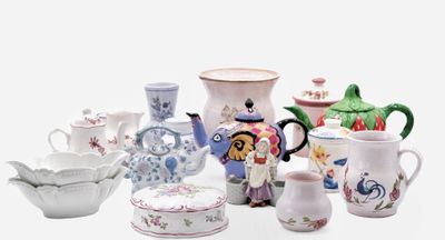 many different types of pottery on the table
