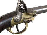 an old gun with a brass handle and a wooden handle