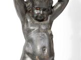 an image of a statue of a boy holding a water jug