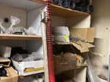 a ladder that is leaning against a wall in a room full of boxes