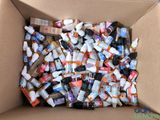 a cardboard box filled with many different types of toothpaste