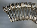 a lot of spoons that are sitting on a table