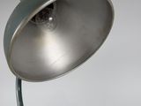 a metal lamp that is on a metal pole