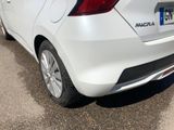 a white car that is parked on the side of the road