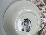 four plates that have different designs on them